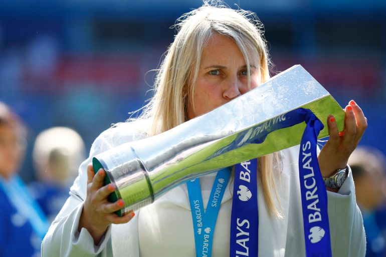 Chelsea manager Emma Hayes holds and kisses the Women's Super League trophy