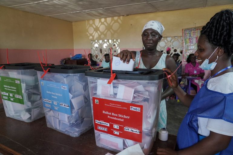 A woman casts her vote during Liberia's presidential election in Monrovia, Liberia