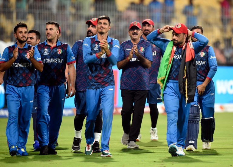 Cricket - ICC Cricket World Cup 2023 - Pakistan v Afghanistan - MA Chidambaram Stadium, Chennai, India - October 23, 2023 Afghanistan players applaud fans after winning the match by 8 wickets REUTERS/Samuel Rajkumar