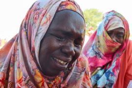Women from the city of Al-Junina (West Darfur) cry after receiving the news about the death of their relatives as they waited for them in Chad, November 7, 2023. REUTERS/El Tayeb Siddig