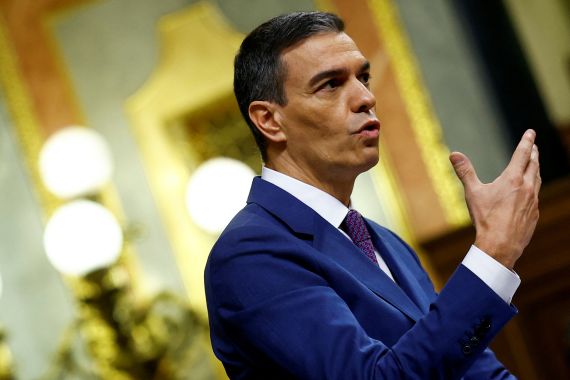 Spain's acting Prime Minister Pedro Sanchez speaks during an investiture debate, as Spain's Socialists seek to clinch a new term following a deal with the Catalan separatist Junts party for government support, a pact which involves amnesties for people involved with Catalonia's failed 2017 independence bid, in Madrid, Spain November 16, 2023. REUTERS/Susana Vera