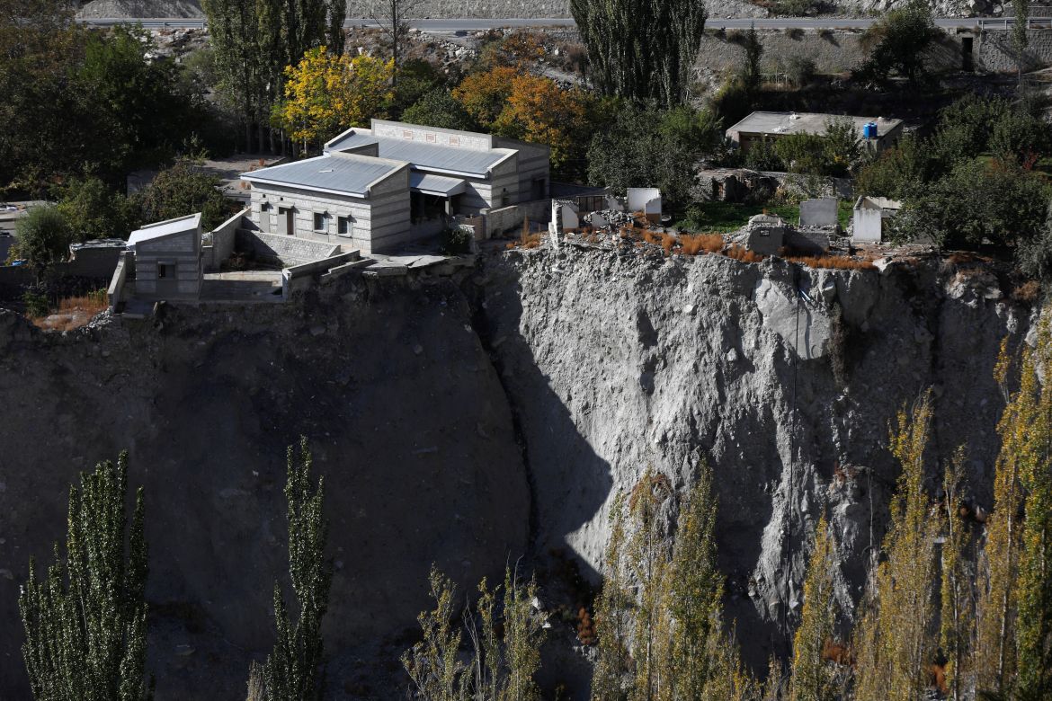 A community hall and houses show signs of damage after a Glacial Lake Outburst Flooding (GLOF) incident occurred from the nearby Shisper glacier, in Hassanabad village, Hunza valley, in the Karakoram mountain range in the Gilgit-Baltistan region of Pakistan.