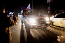A Red Cross vehicle arrives at the Rafah border in the southern Gaza Strip, November 30, 2023 [Ibraheem Abu Mustafa/Reuters]
