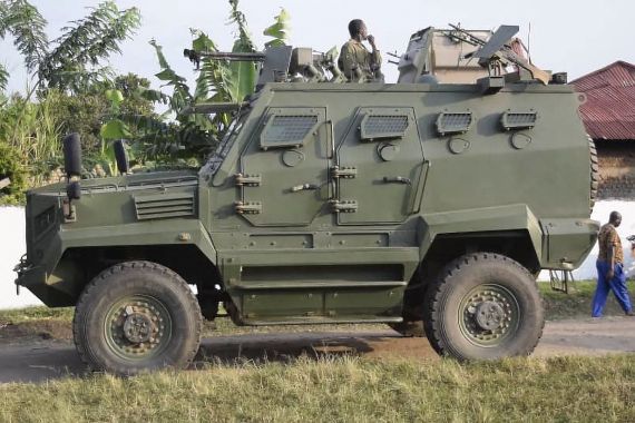 A Uganda People's Defence Force (UPDF) armored personnel carrier is seen outside the premises of an attack in Mpondwe, Uganda, on June 17, 2023 at the Mpondwe Lhubiriha Secondary School. The death toll from an attack on a school in western Uganda by militants linked to the Islamic State group has risen to 37, the country's army spokesman said Saturday. (Photo by AFP)