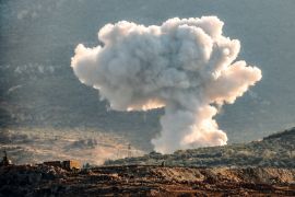 A plume of smoke rises above hills near the city of Jisr ash-Shughur, in the rebel-held northwestern Idlib governorate, during bombardment by pro Syrian regime forces on October 6, 2023. (Photo by Muhammad HAJ KADOUR / AFP)