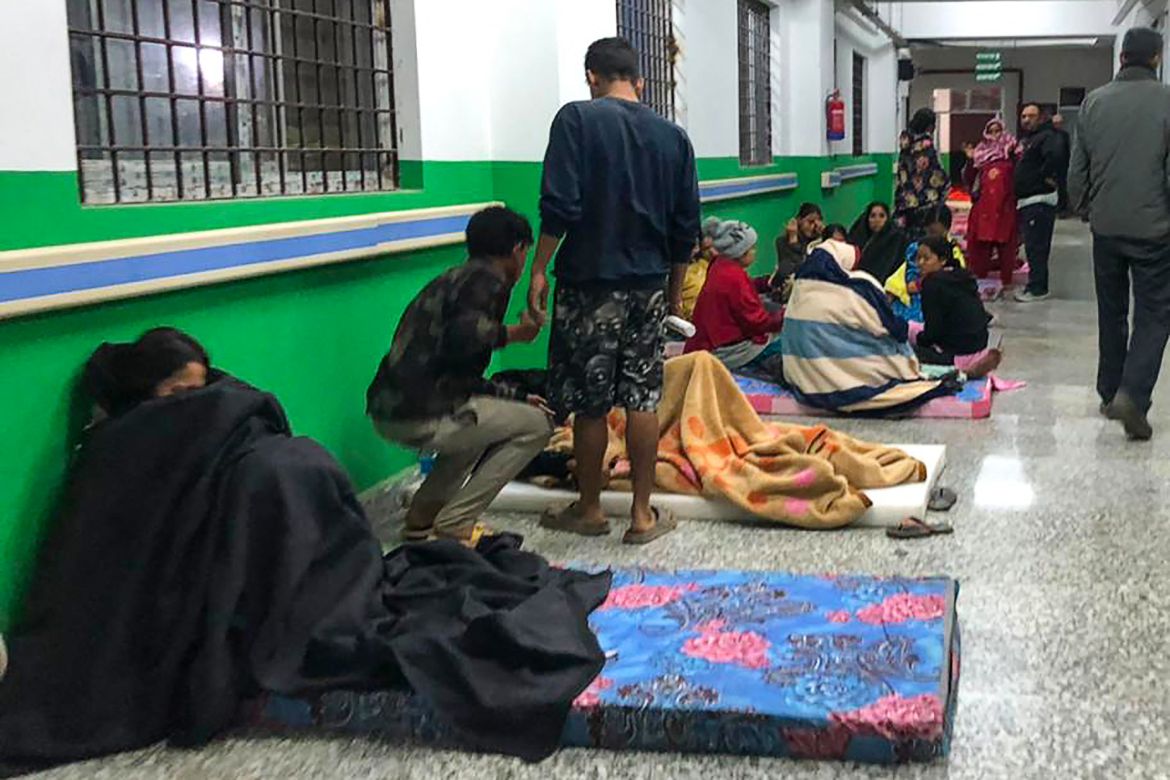 Survivors are seen at a corridor of the Jajarkot district hospital in the aftermath of an earthquake in Jajarkot
