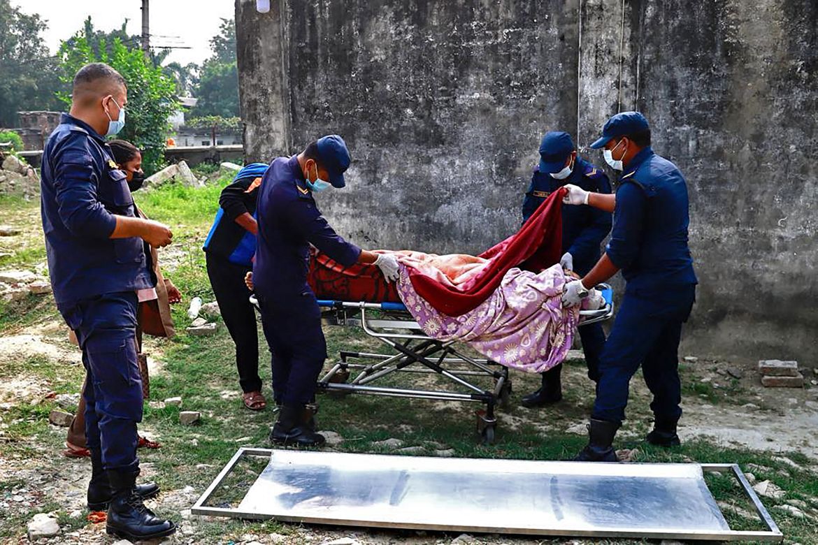 Medical personnel attend to a wounded victim at a hospital in Nepalgunj after an earthquake in western Nepal on November 4