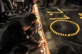 People light candles at a vigil demanding release of captives held in Gaza