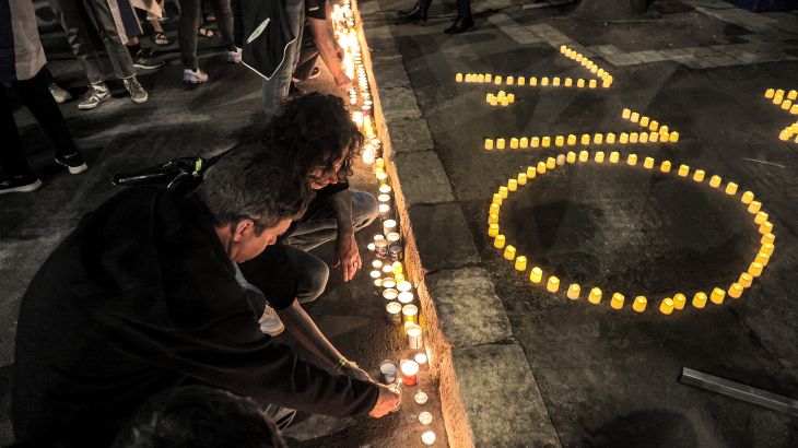 People light candles at a vigil demanding release of captives held in Gaza