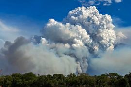 Clouds of smoke billow from forest fires in the Pantanal wetland in Porto Jofre, Mato Grosso State, Brazil.