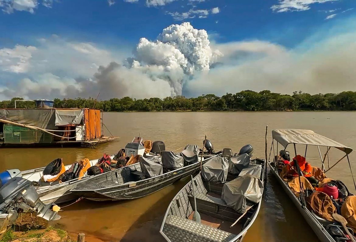 Clouds of smoke billow from forest fires in the Pantanal wetland in Porto Jofre, Mato Grosso State, Brazil.