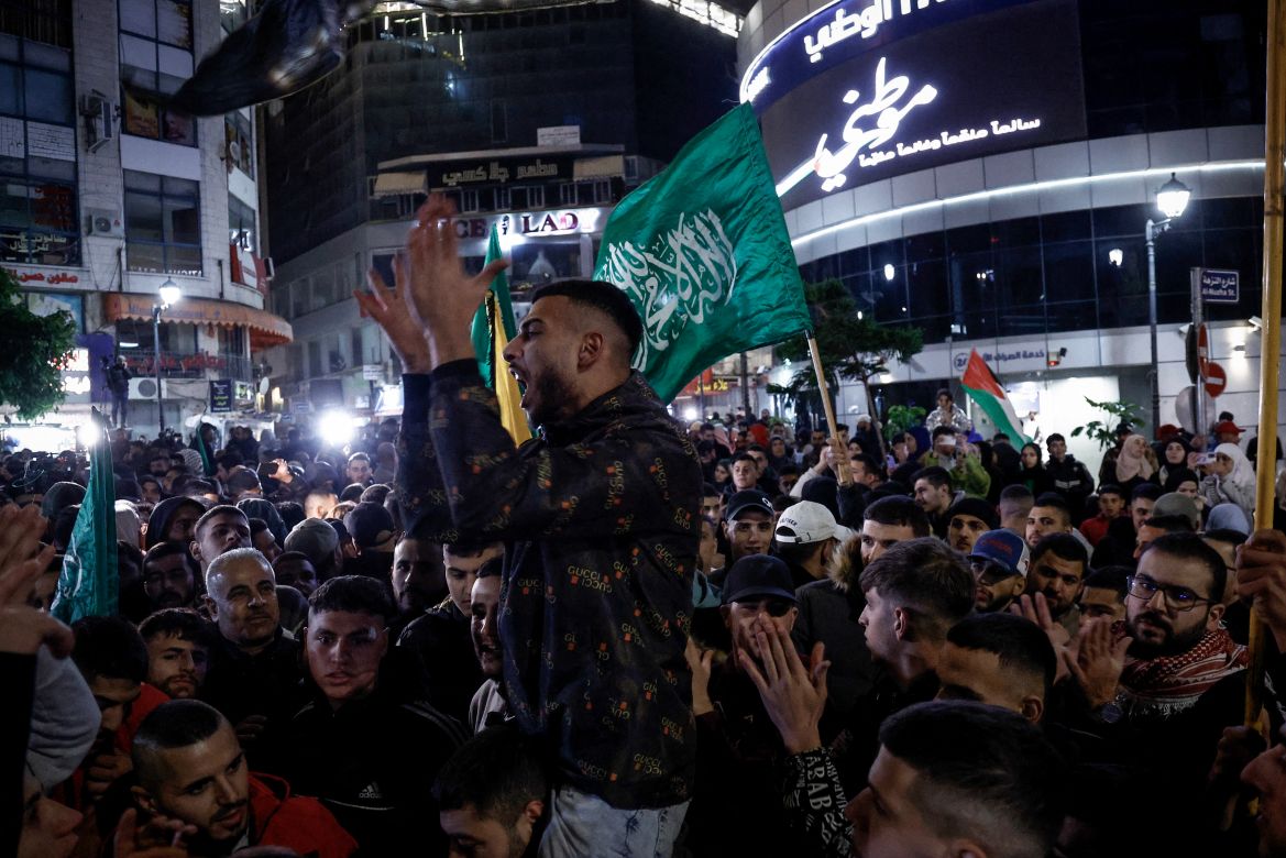 Palestinian prisoners are welcomed by a crowd after being released from Israeli jails in exchange for hostages released by Hamas from the Gaza Strip, in Ramallah in the occupied West Bank.
