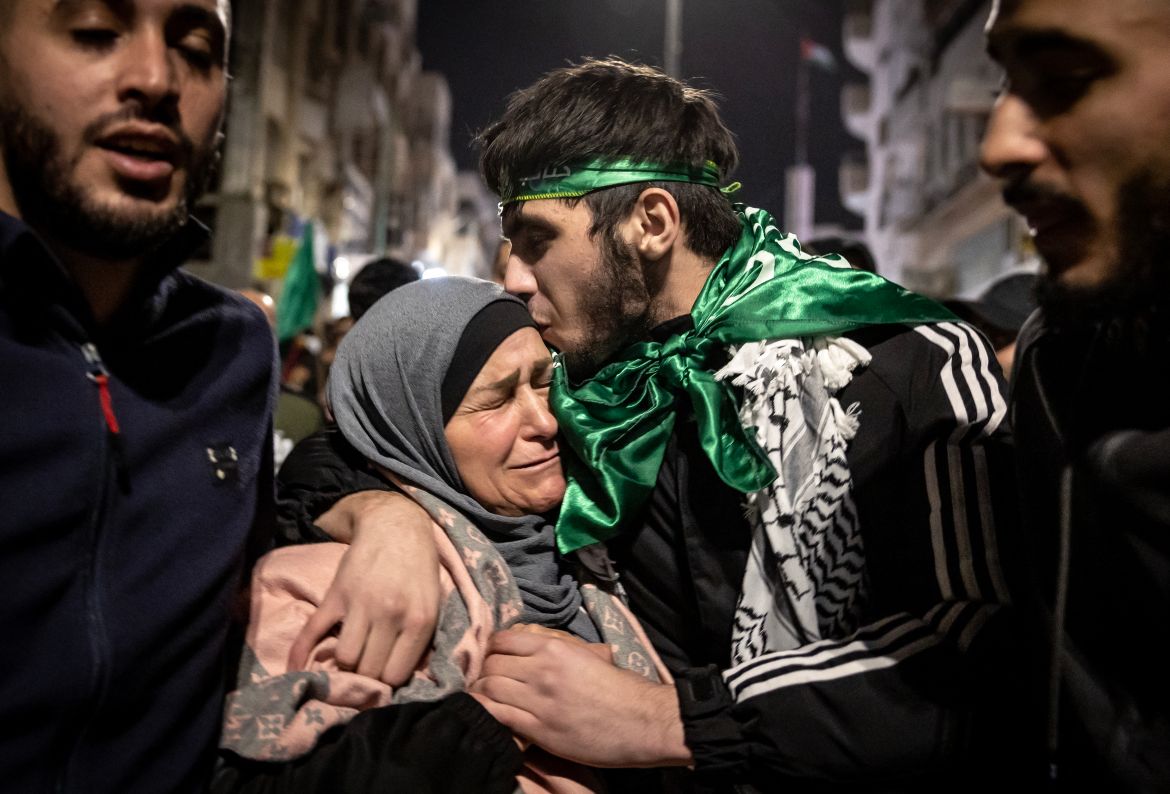 A Palestinian prisoner hugs his mother after being released from an Israeli jail.