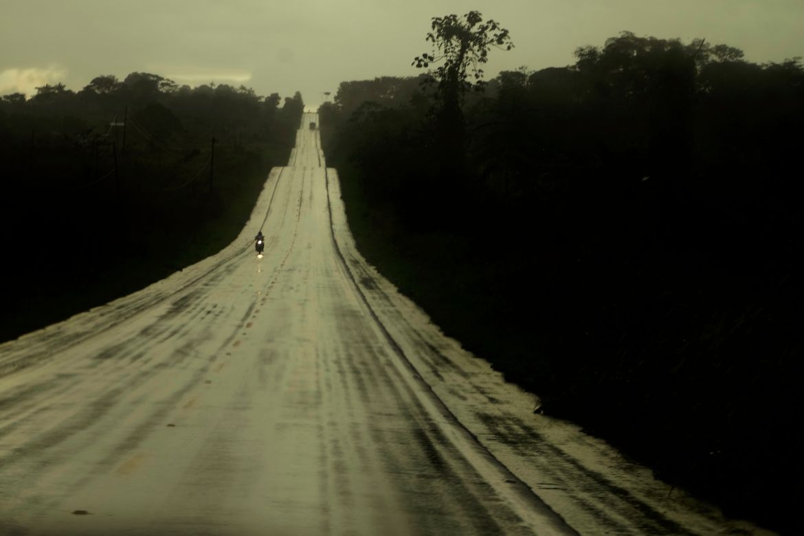Drivers travel along a road to access farms and transport agricultural products in the rural area of the Rio Branco, Acre state, Brazil.