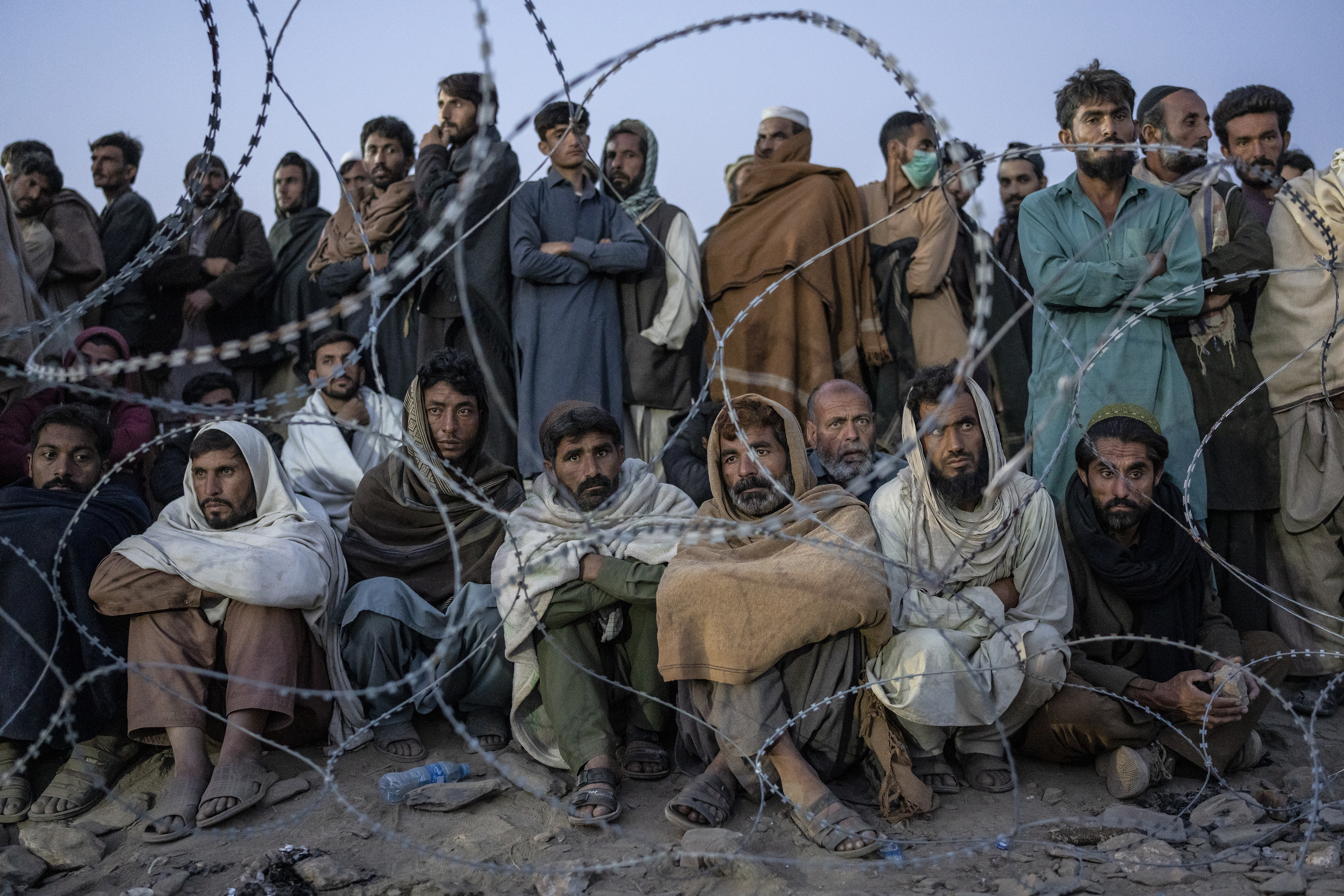 Afghan refugees wait to register in a camp near the Torkham Pakistan-Afghanistan border in Torkham, Afghanistan.