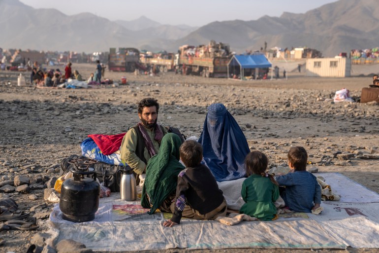 Afghan refugees settle in a camp near the Torkham Pakistan-Afghanistan border in Torkham, Afghanistan, Saturday.