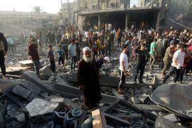 Palestinians look for survivors following an Israeli airstrike in Khan Younis refugee camp, southern Gaza Strip.