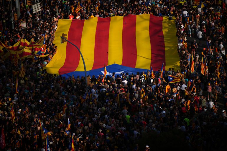 An independence flag is held at a demonstration in Catalonia