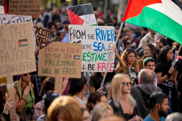 FILE - Protesters gather for a pro-Palestinian demonstration, in Rome, Saturday, Oct. 28, 2023. The Jordan River is a winding, 200-plus-mile run to the east of Israel and the West Bank. The sea is the glittering Mediterranean to its west. But a phrase about the space in-between, “from the river to the sea,” has become a battle cry with new power to roil Jews and pro-Palestinian activists in the aftermath of Hamas’ murderous rampage across southern Israel Oct. 7 and Israel’s bombardment of Gaza. (AP Photo/Andrew Medichini, File)