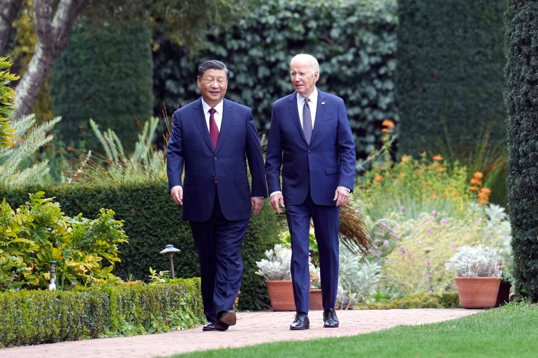 Xi and Biden walking in the gardens of the Filoli Estate. They look relaxed.