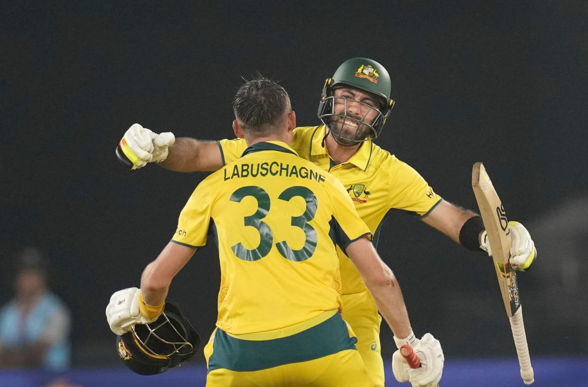 Australia's Glenn Maxwell, facing the camera and teammate Marnus Labuschagne celebrate after hitting the wining shot after to won the ICC Men's Cricket World Cup final match against India in Ahmedabad, India.