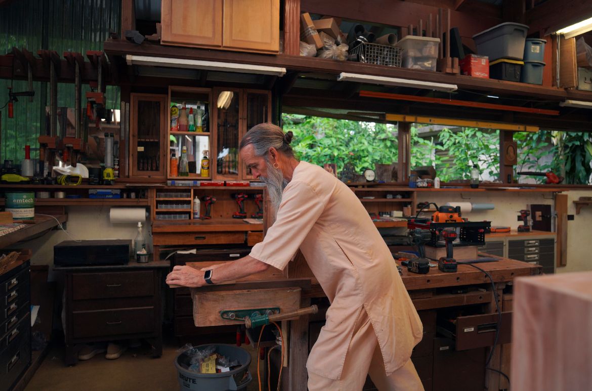 Acharya Kumarnathaswami shapes a piece of wood at Kauai's Hindu Monastery in Kapaa, Hawaii.