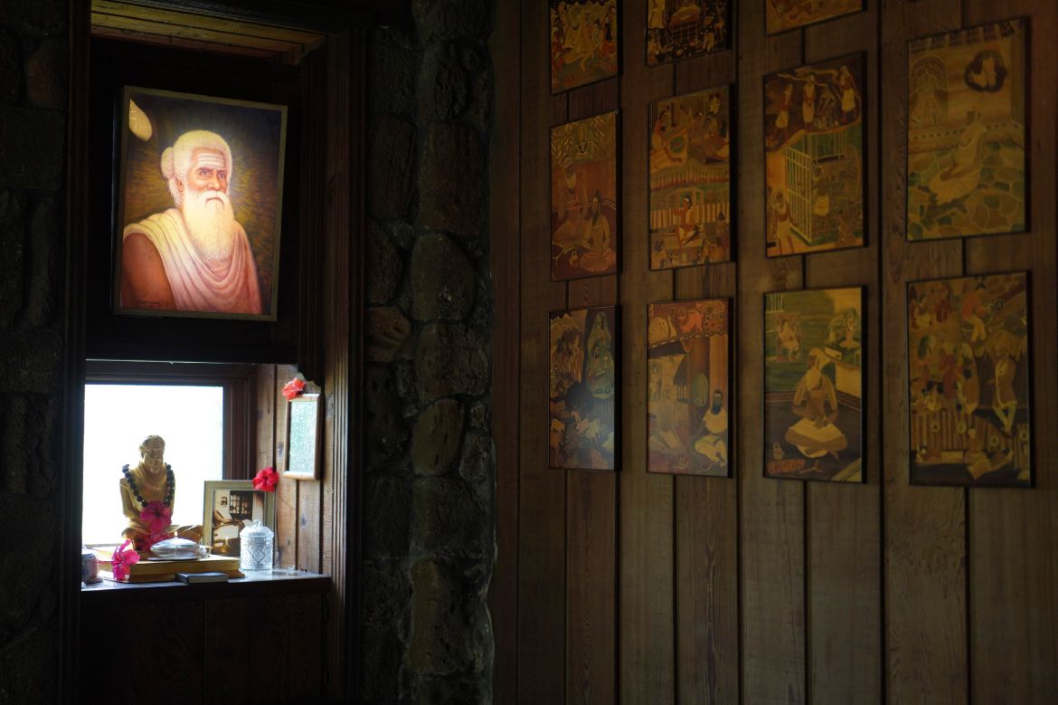 A lit photo of Satguru Sivaya Subramuniyaswami, left, the founding guru of Kauai's Hindu Monastery, hangs in a meditation room.