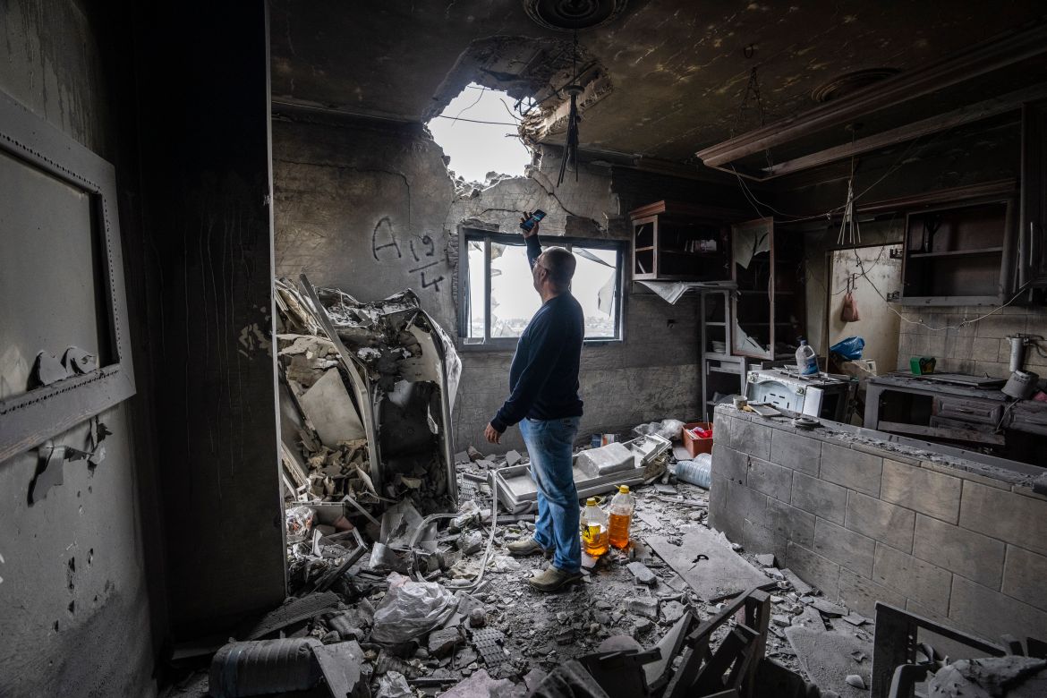 Hussein Fawaz inspects damages to his family house that was hit by Israeli shelling in the Kfar Kila border village with Israel in south Lebanon.