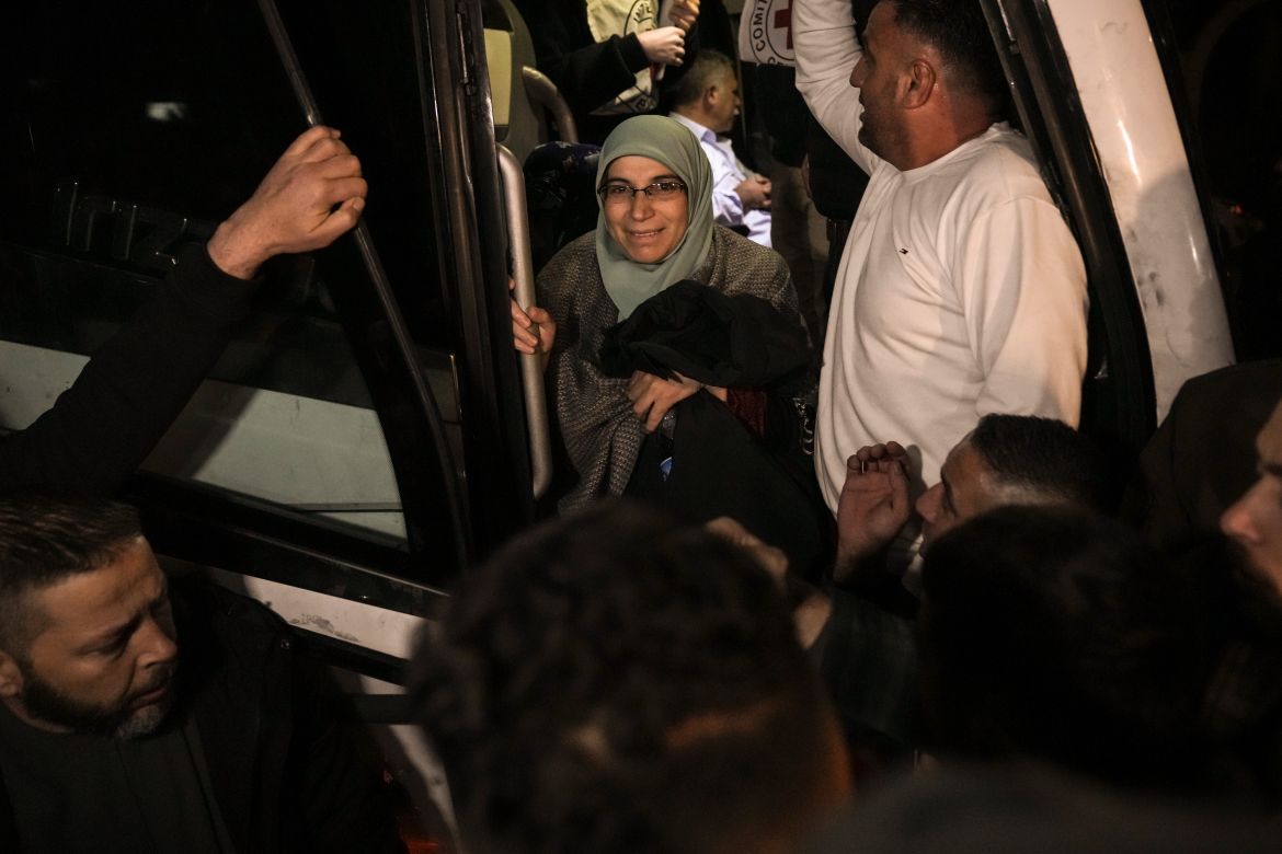 A woman smiles after being released from prison by Israel, in the West Bank town of Ramallah.