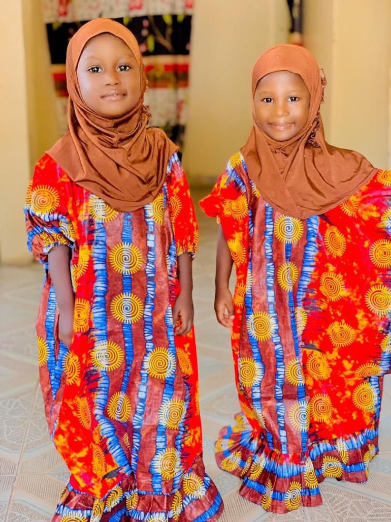 Adama (left) and her twin, Hawa. Their father, Ebrima Saidy, says he has not found a way to tell Hawa that her sister is not coming back home [Courtesy: Ebrima Sandy]
