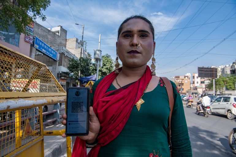Ayesha Sharma, a transgender beggar in Delh, India, uses digital payments