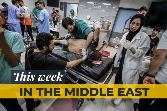 Doctors examine an injured man after Israeli attacks, are taken to Al-Shifa Hospital as Israeli attacks continue