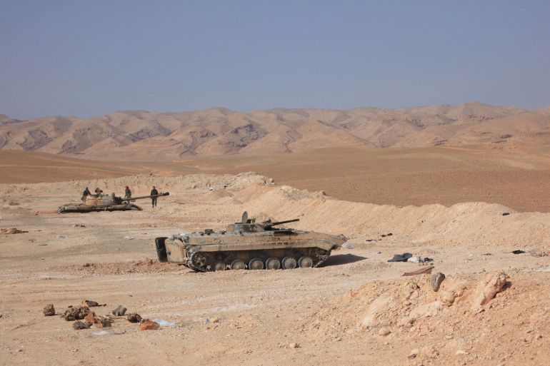 Tanks belonging to Syrian government forces are positioned near the Jazel oil field, near the ancient city of Palmyra in the east of Homs province after they retook the area from Islamic State (IS) group fighters on March 9, 2015. Recent US-led coalition air strikes have frequently targeted oil facilities run by the IS group jihadists, who according to some estimates earn more than $1 million per day from oil sales. AFP PHOTO/ STR (Photo by AFP)