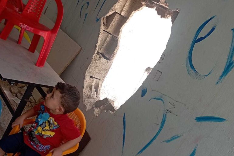 A hole is seen on the wall of the Children's Centre in the Jenin Refugee Camp after an Israeli raid in july