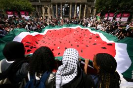 People participate in a demonstration in support of Palestinians in Gaza, in Melbourne, Australia on November 23, 2023 [AP/Joel Carrett]