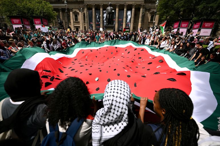 People participate in a demonstration in support of Palestinians in Gaza, in Melbourne, Australia November 23, 2023. AAP Image/Joel Carrett via REUTERS ATTENTION EDITORS - THIS IMAGE WAS PROVIDED BY A THIRD PARTY. NO RESALES. NO ARCHIVE. NEW ZEALAND OUT. NO COMMERCIAL OR EDITORIAL SALES IN NEW ZEALAND. AUSTRALIA OUT. NO COMMERCIAL OR EDITORIAL SALES IN AUSTRALIA