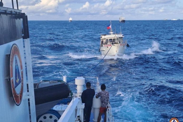 The Philippines resupply boat being towed by the coast guard after the incident with China