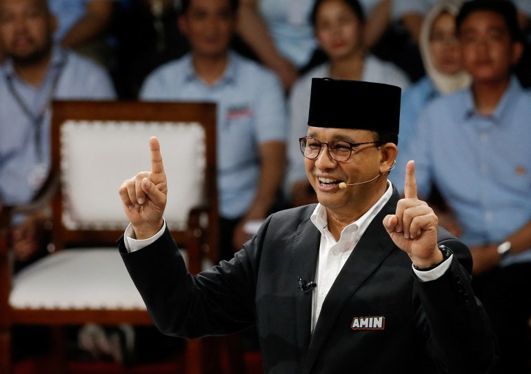 Anies Baswedan makes a point during the debate