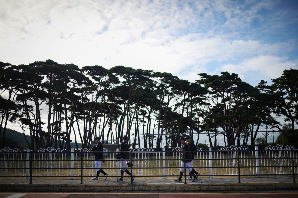 Members of the Deokjeok High School baseball team walk to school on Deokjeok island in Incheon, South Korea.
