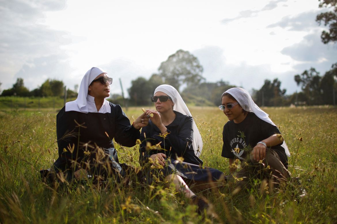 Members of Sisters of the Valley, a non-religious international group founded in 2014 which has pledged to spread the gospel of the healing powers of cannabis, who use the monikers "Sister Kika," "Sister Bernardet" and "Sister Yeri" online and asked not to give their names for fear of reprisal, smoke a joint at the Sisters of the Valley's farm on the outskirts of a village in central Mexico, September 2, 2023.