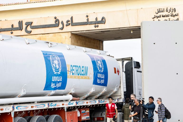 A truck carrying humanitarian aid from the UNRWA arrives at the Egyptian side of the Rafah border crossing with the Gaza Strip