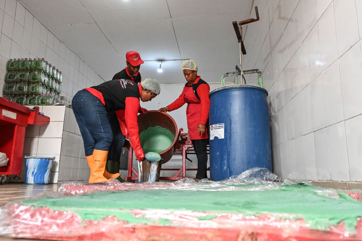 Workers make soap and gel from snail slime at the factory in Azaguie.