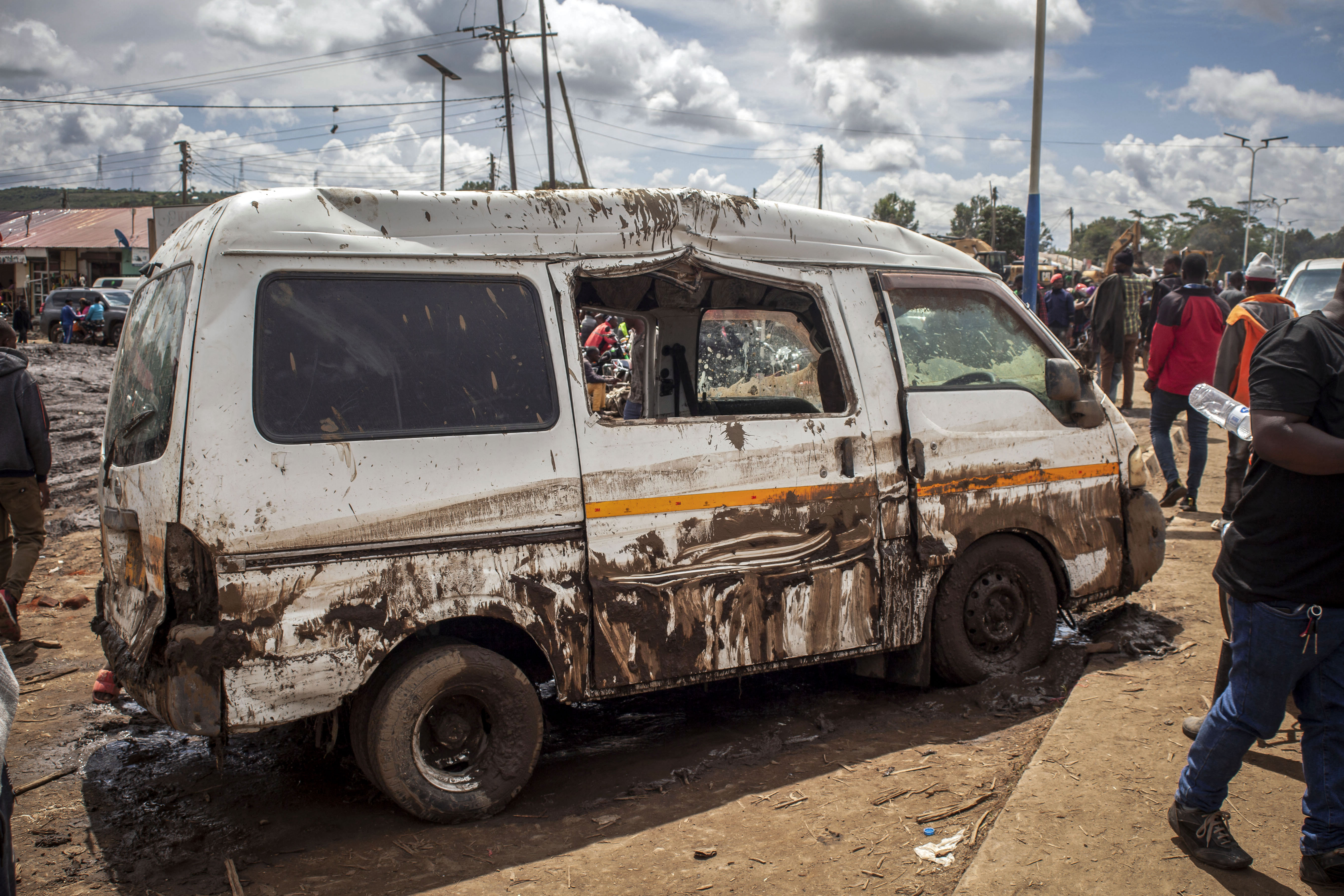 A damaged van is seen on a street following landslides and flooding triggered by heavy rainfall in Katesh, Tanzania.