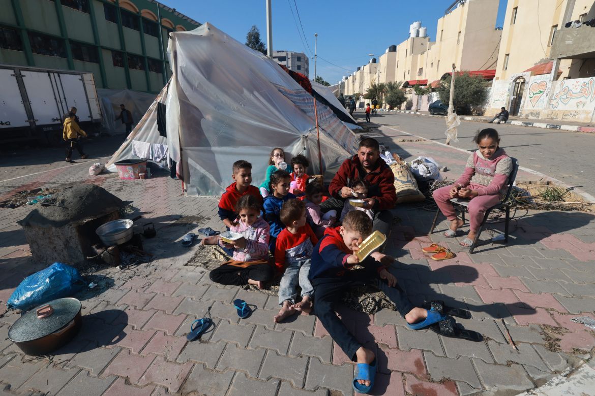 A displaced Palestinian family who fled Khan Yunis sets up camp in Rafah further south near the Gaza Strip's border with Egypt.