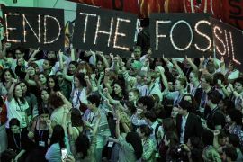 Protesters at COP28 calling for an end to fossil fuels