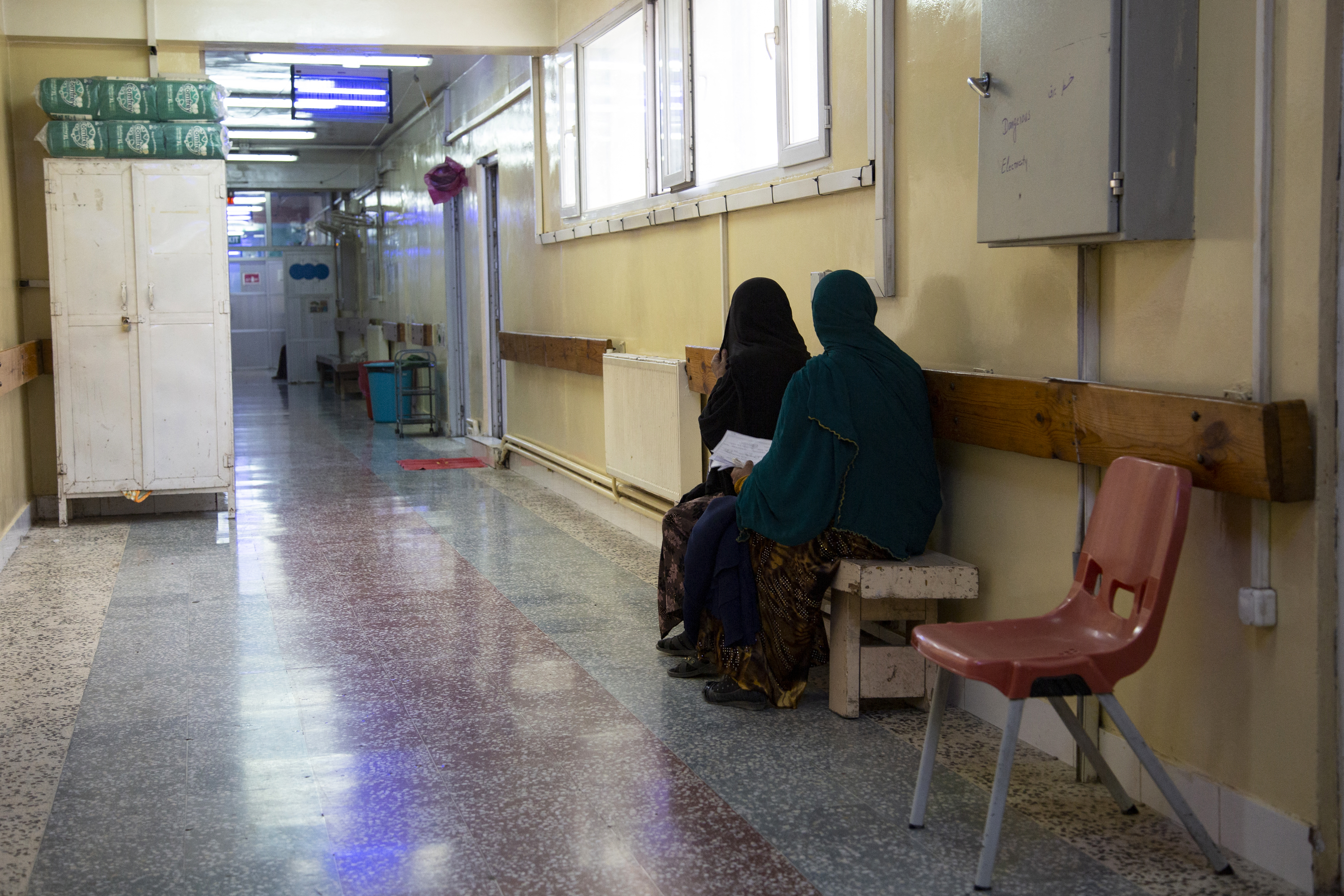 In this photograph taken on December 8, 2023, pregnant women wait at the corridor of the Doctors Without Borders (MSF)-run maternity hospital in Khost.