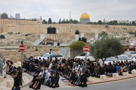 The Dome of the Rock mosque at the Al-Aqsa Mosque compound is seen as Palestinian Muslims gather for Friday prayers in east Jerusalem on December 29