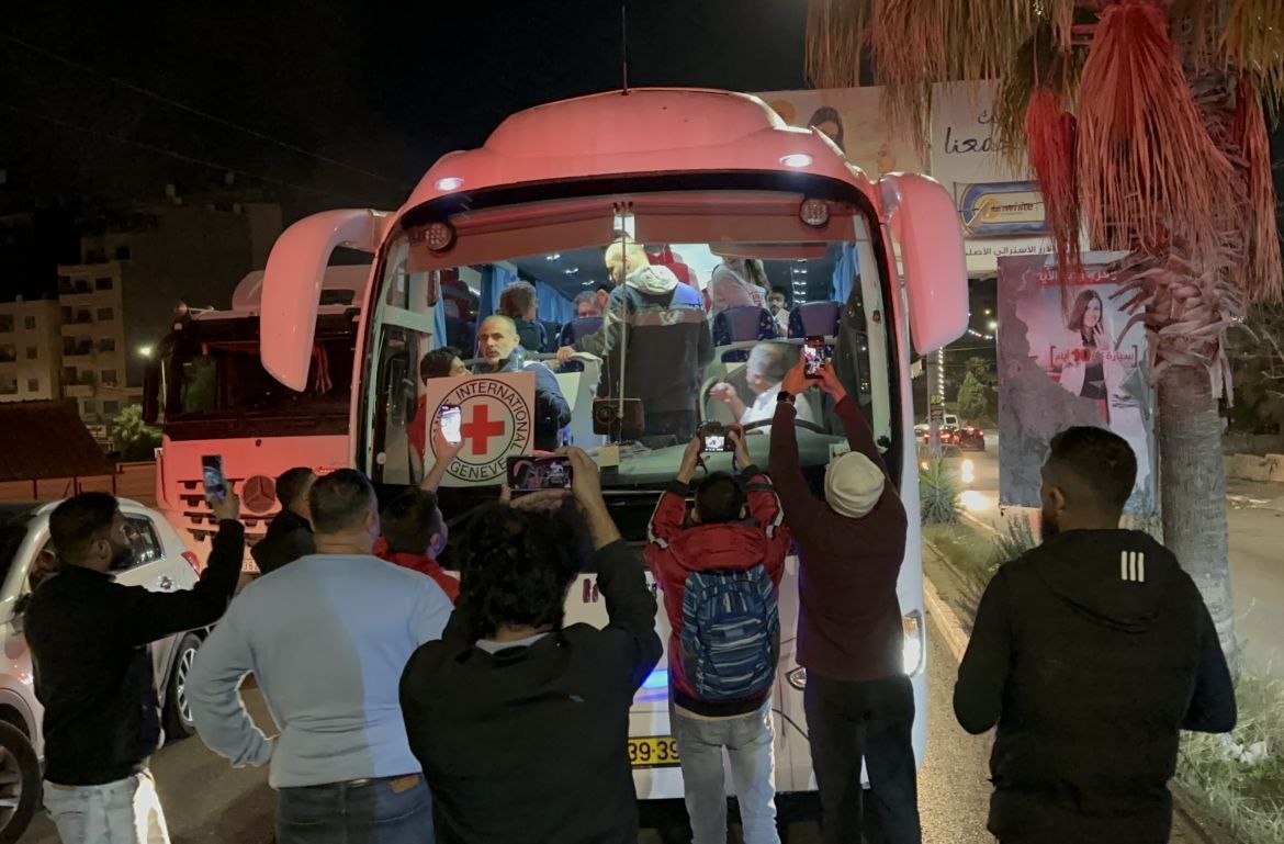 Palestinian hostages released from Israeli jails arrive in Beitunia, West Bank by a bus belonging to the International Committee of the Red Cross (ICRC).