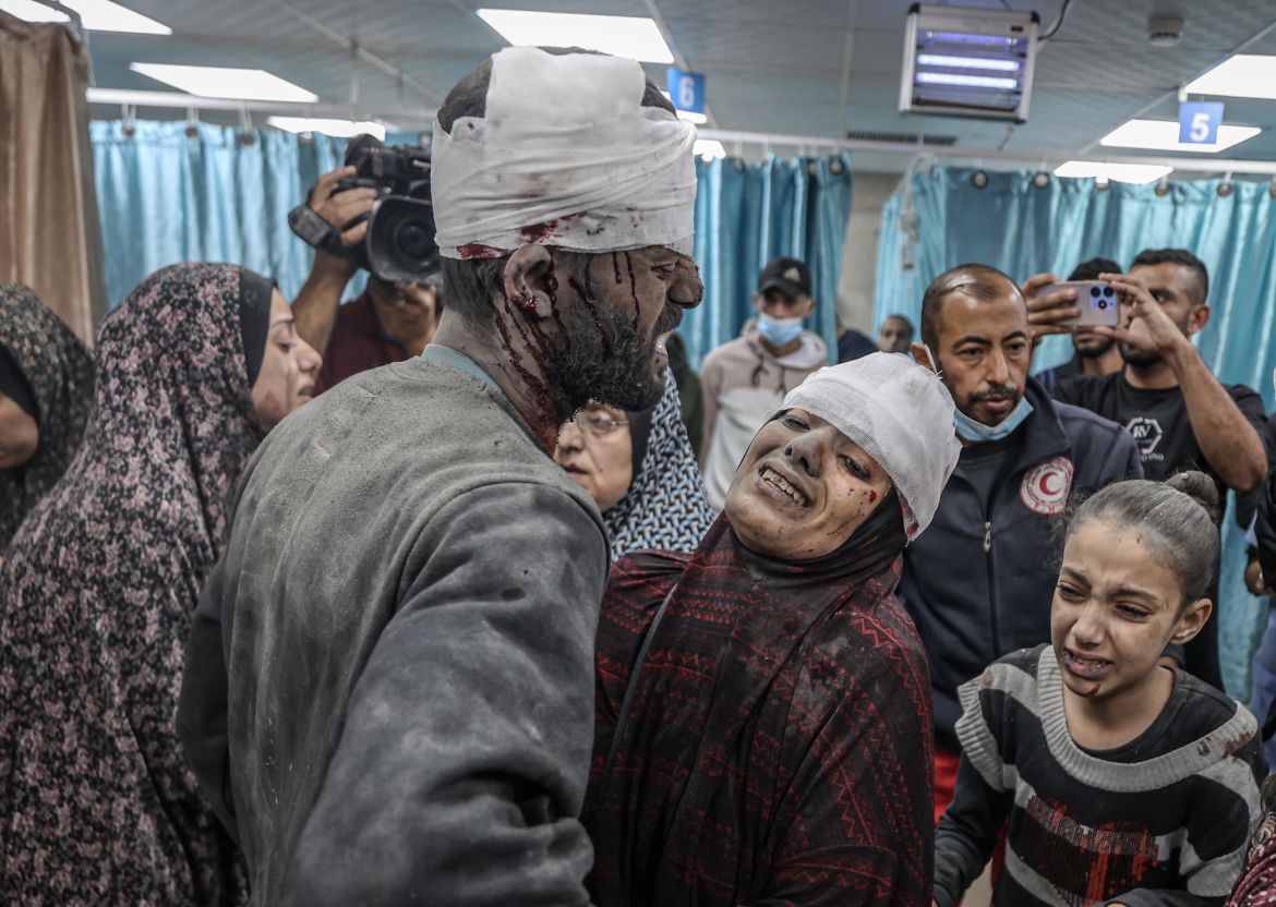 Image depicts graphic content) Injured people, including children, are brought to Al-Aqsa Martyrs Hospital for treatment after an Israeli attack at the end of the humanitarian pause between Israel and Hamas in Deir al-Balah, Gaza on December 02