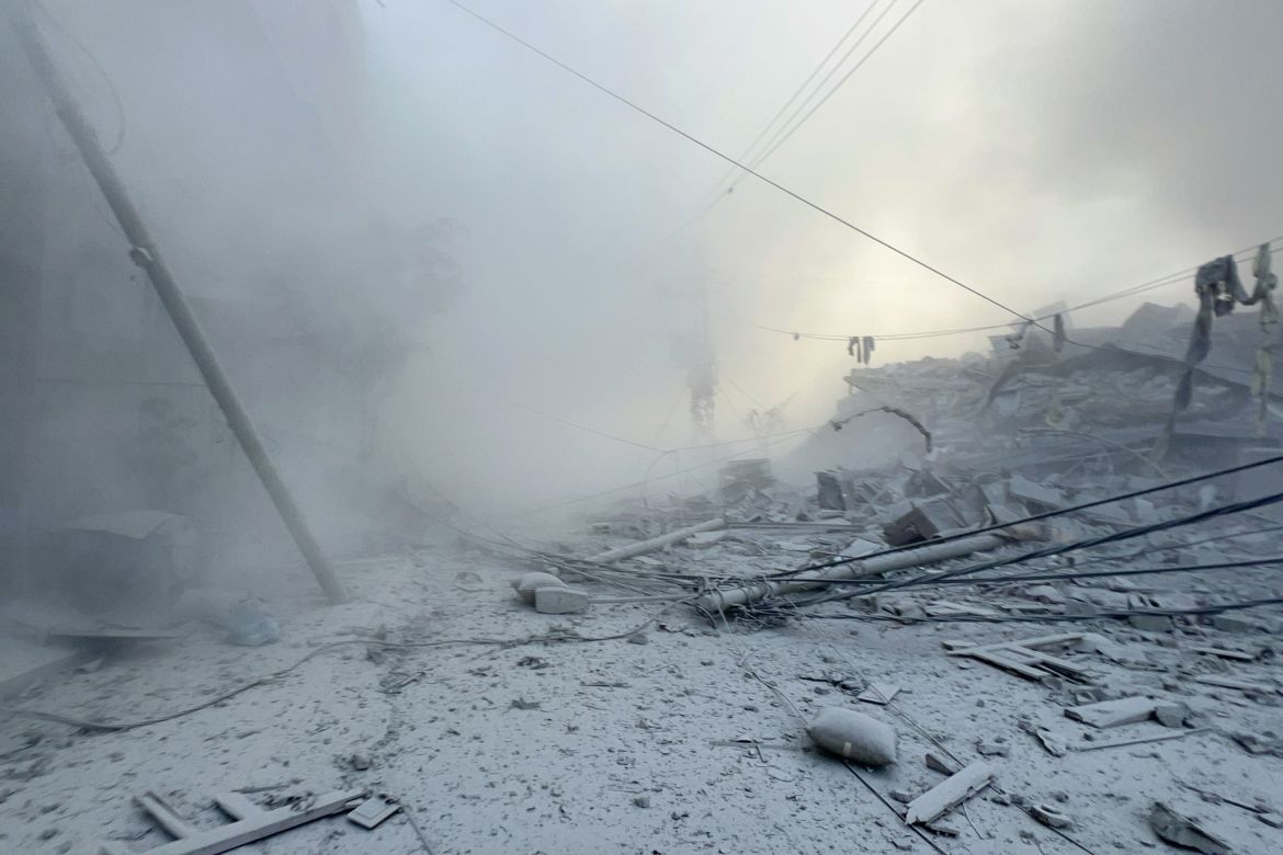 Smoke and dust rise after the Israeli airstrikes hit a residential building and caused casualties in Tal al-Zaatar area